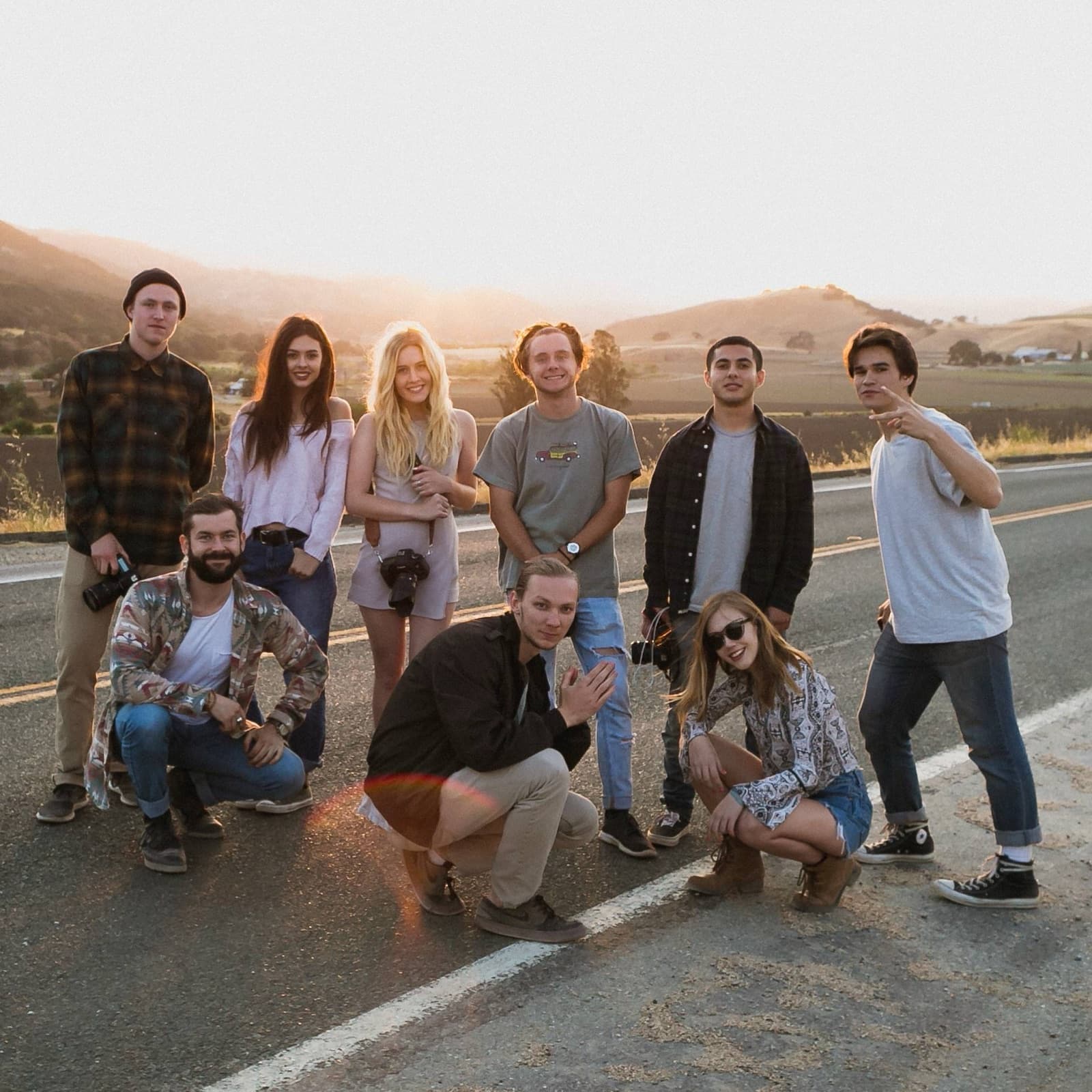 Creators at sunset on a country road