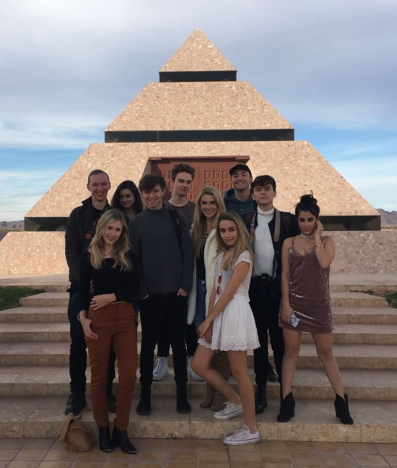Creators in front of a pyramid in the desert